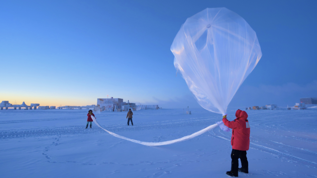 NOAA scientists launch a weather balloon carrying an ozonesonde at the South Pole on October 1, 2023. (Image credit: Marc Jaquart/IceCube)